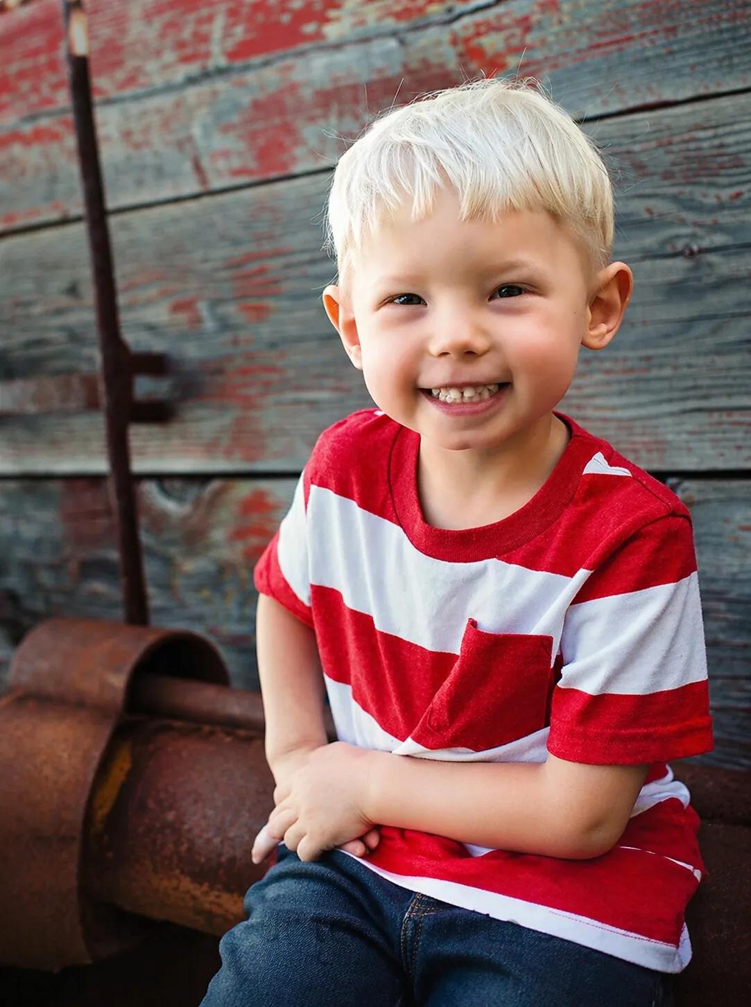 Young child in a red striped shirt — “Let Dr. Carroll protect your teeth with sealants.”
