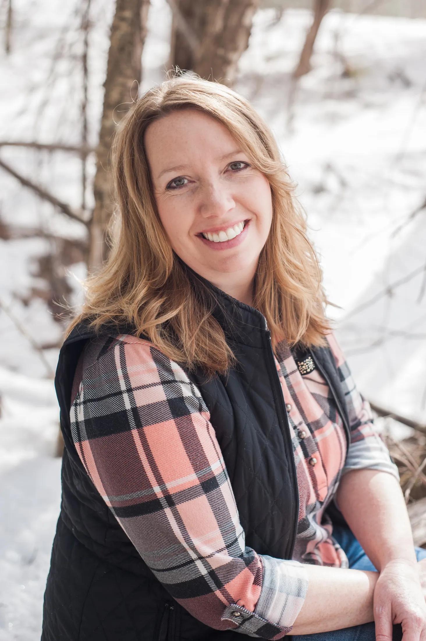 A patient smiling outdoors in winter — comfort-first care at River Street Dental, Spooner WI